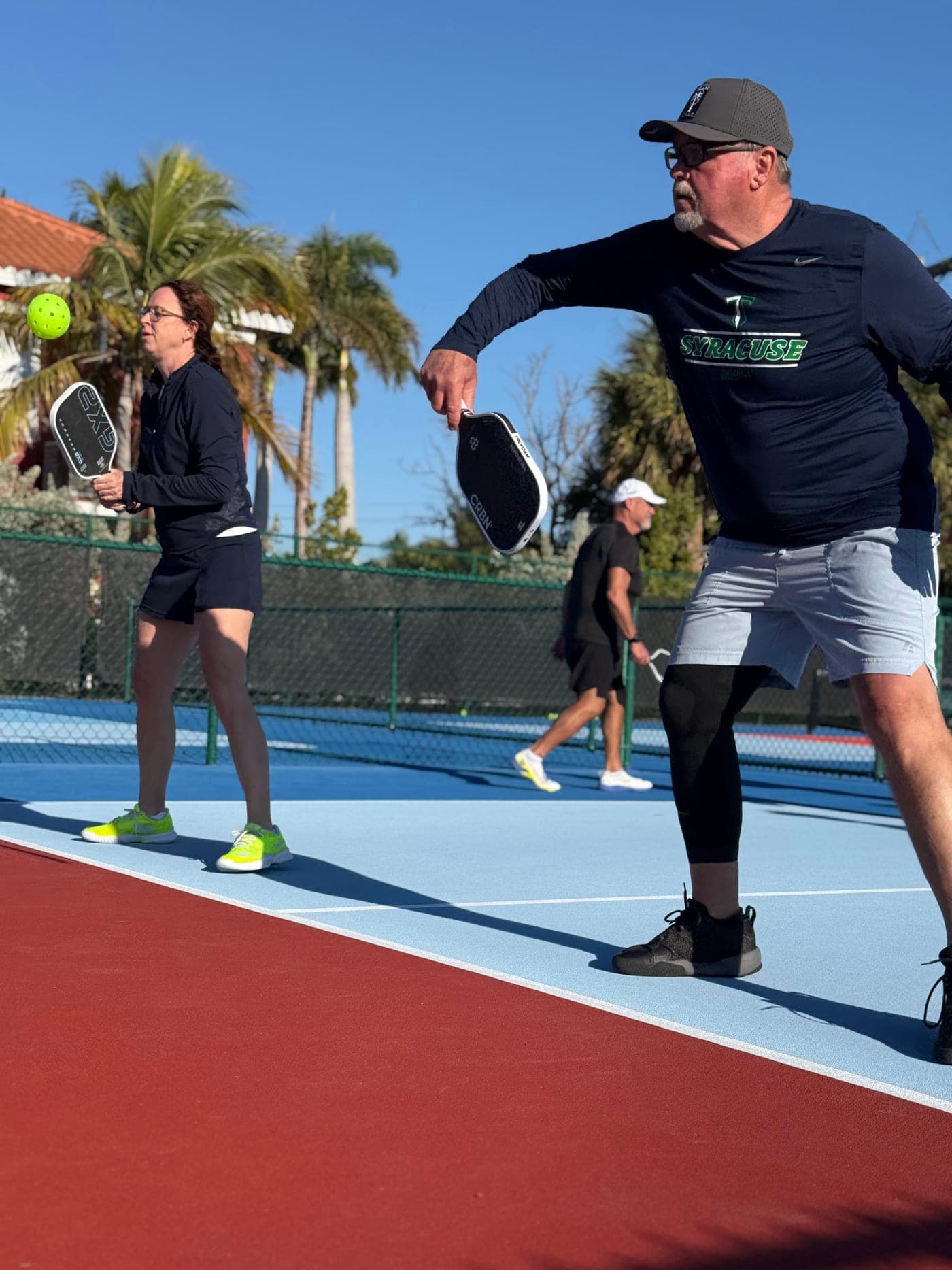 Bill P. driving a forehand from the baseline